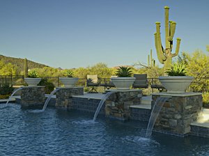 Backyard swimming pool and decking built by Saturn Pool Company in Arizona