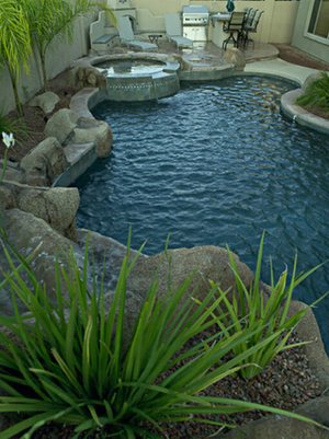 Backyard swimming pool and decking built by Saturn Pool Company in Arizona