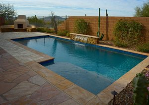 Backyard swimming pool and decking built by Saturn Pool Company in Arizona