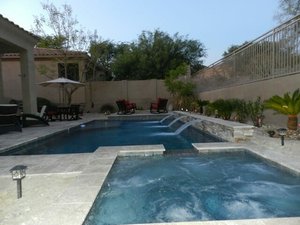 Backyard swimming pool and decking built by Saturn Pool Company in Arizona