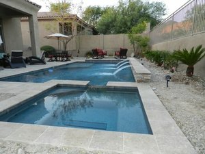 Custom concrete swimming pool built by Saturn Pool Company in Arizona