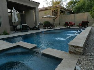 Custom pool and outdoor living space built by Saturn Pool Company in Arizona