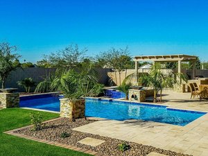 Custom concrete swimming pool built by Saturn Pool Company in Arizona
