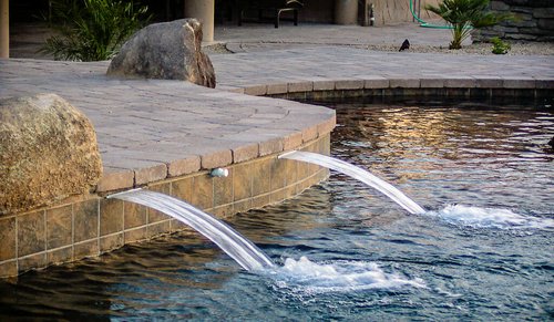 Backyard swimming pool and decking built by Saturn Pool Company in Arizona